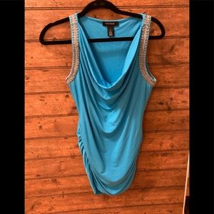 White House Black Market top size small. Cinched sides and bead details